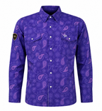 A women's long-sleeve button-up shirt in a vibrant purple color, featuring an all-over paisley pattern in shades of purple and pink. The shirt has two buttoned chest pockets, a pointed collar, and a small black shield patch on the right sleeve 