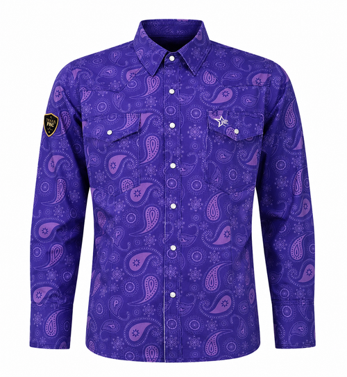 A women's long-sleeve button-up shirt in a vibrant purple color, featuring an all-over paisley pattern in shades of purple and pink. The shirt has two buttoned chest pockets, a pointed collar, and a small black shield patch on the right sleeve 